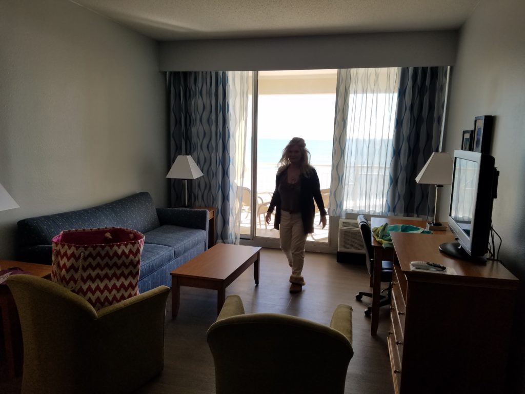 Holiday Inn Resort King suite living room with balcony overlooking Wrightsville Beach